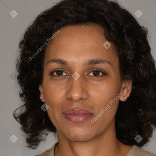 Joyful black adult female with medium  brown hair and brown eyes