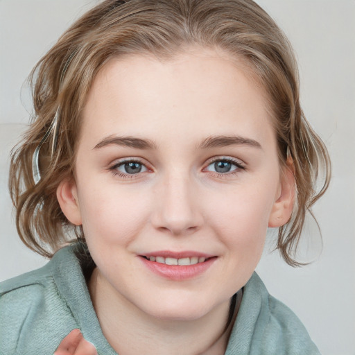 Joyful white young-adult female with medium  brown hair and blue eyes