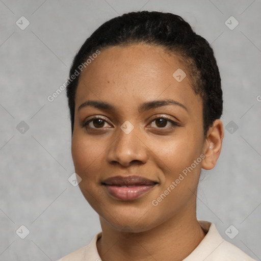 Joyful latino young-adult female with short  black hair and brown eyes