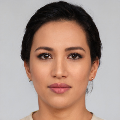 Neutral latino young-adult female with medium  black hair and brown eyes