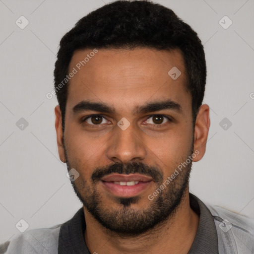 Joyful latino young-adult male with short  black hair and brown eyes