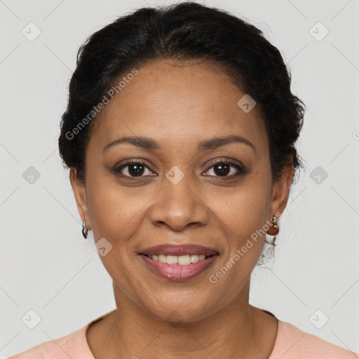 Joyful latino adult female with short  brown hair and brown eyes