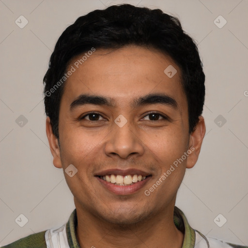 Joyful latino young-adult male with short  black hair and brown eyes