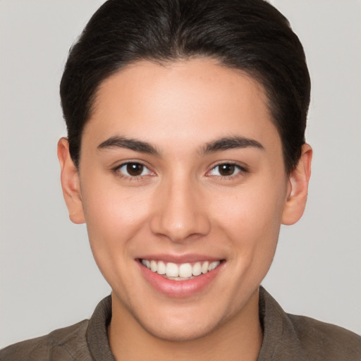 Joyful white young-adult female with short  brown hair and brown eyes