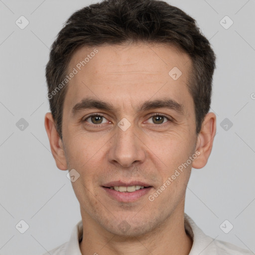 Joyful white adult male with short  brown hair and brown eyes