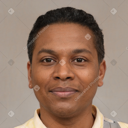 Joyful latino adult male with short  black hair and brown eyes