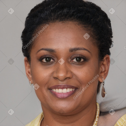 Joyful black young-adult female with short  brown hair and brown eyes