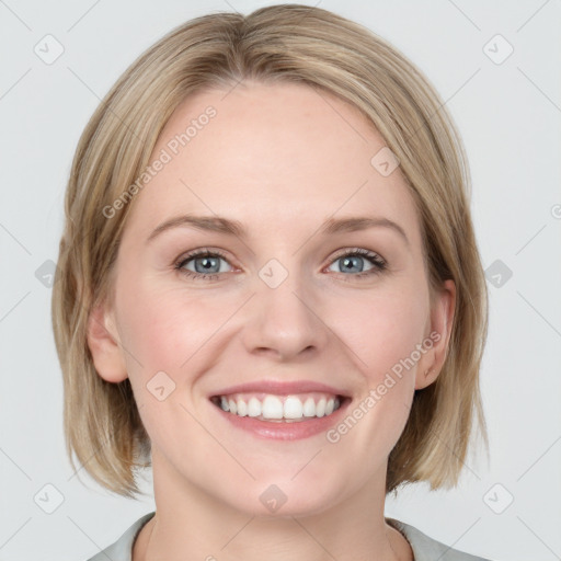 Joyful white young-adult female with medium  brown hair and blue eyes