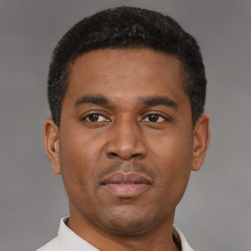 Neutral latino young-adult male with short  brown hair and brown eyes