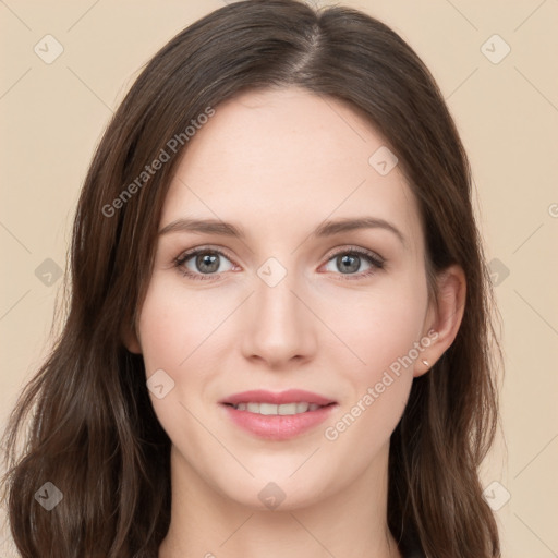 Joyful white young-adult female with long  brown hair and green eyes