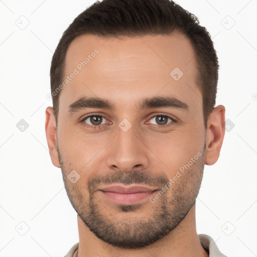 Joyful white young-adult male with short  brown hair and brown eyes