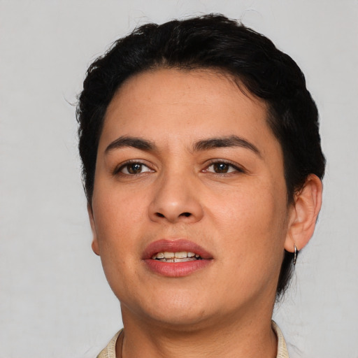 Joyful white young-adult female with short  black hair and brown eyes