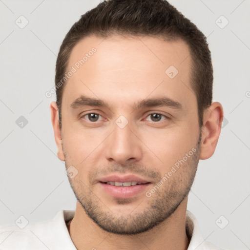 Joyful white young-adult male with short  brown hair and brown eyes