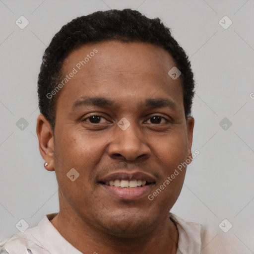 Joyful latino young-adult male with short  brown hair and brown eyes