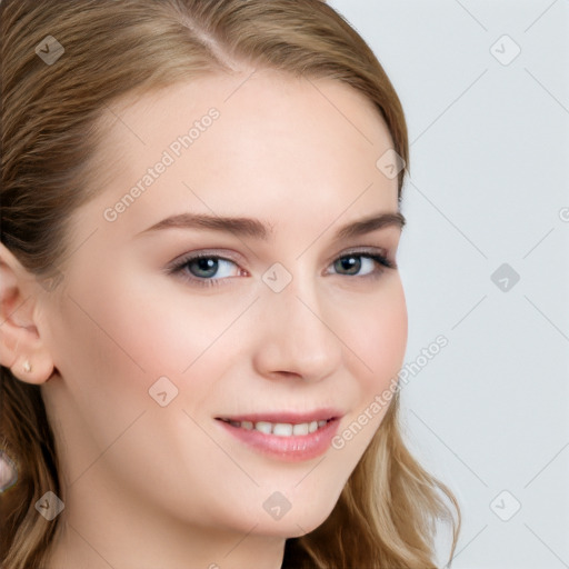 Joyful white young-adult female with long  brown hair and blue eyes