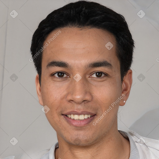 Joyful white young-adult male with short  black hair and brown eyes