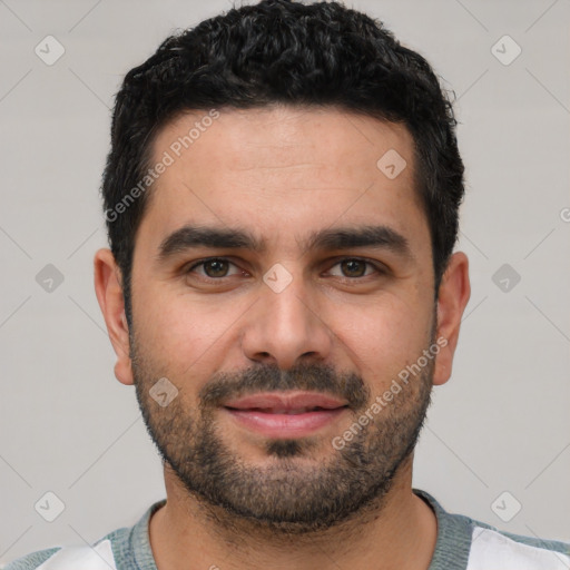 Joyful white young-adult male with short  black hair and brown eyes