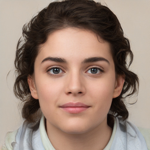 Joyful white child female with medium  brown hair and brown eyes