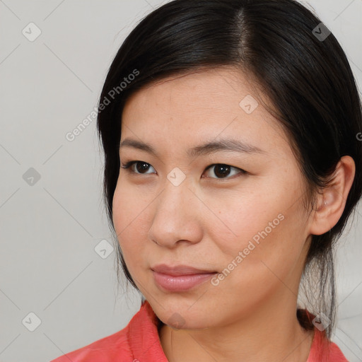 Joyful asian young-adult female with medium  brown hair and brown eyes