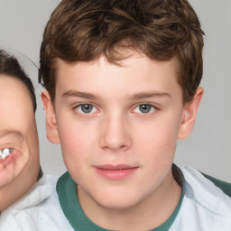 Joyful white child male with short  brown hair and brown eyes