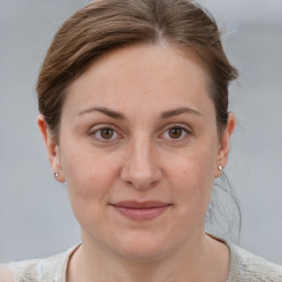 Joyful white adult female with short  brown hair and grey eyes