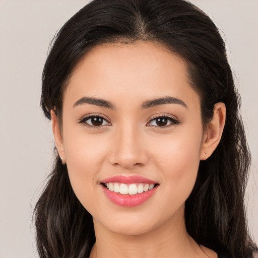 Joyful white young-adult female with long  brown hair and brown eyes