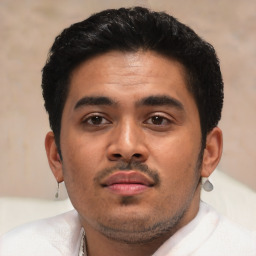 Neutral latino young-adult male with short  black hair and brown eyes