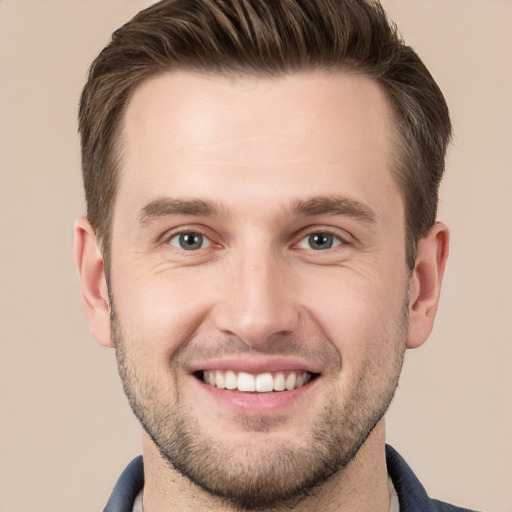 Joyful white young-adult male with short  brown hair and brown eyes