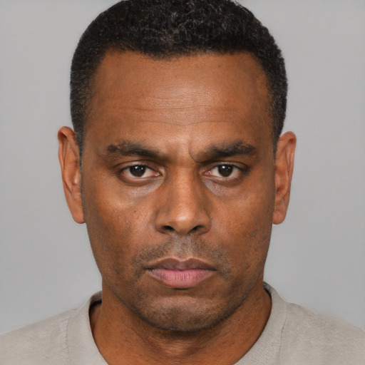 Neutral black adult male with short  brown hair and brown eyes