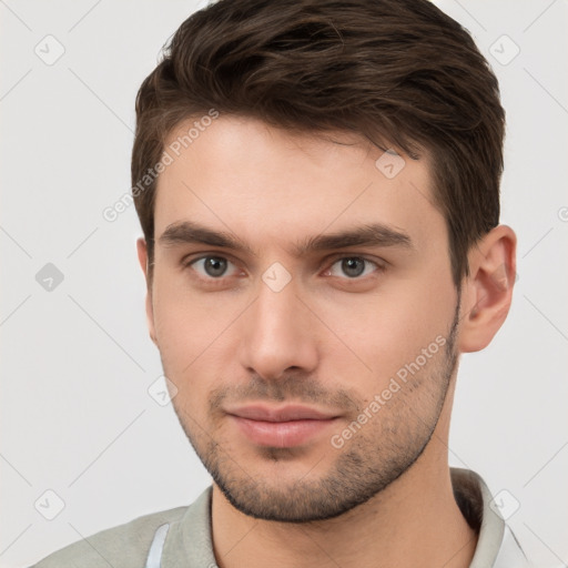 Neutral white young-adult male with short  brown hair and brown eyes