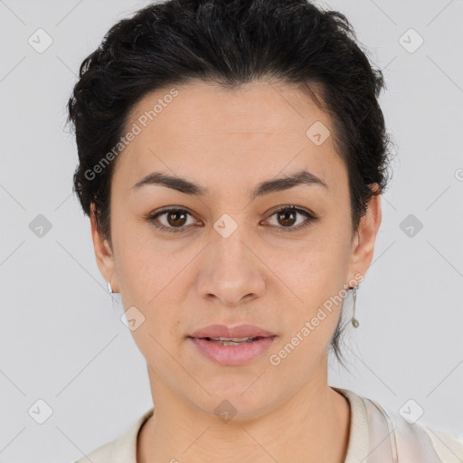 Joyful latino young-adult female with short  brown hair and brown eyes