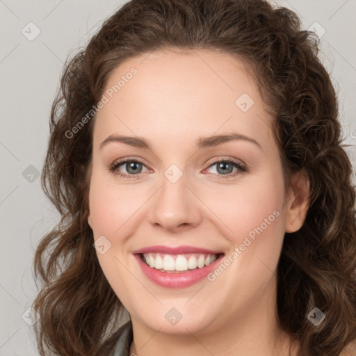 Joyful white young-adult female with medium  brown hair and green eyes