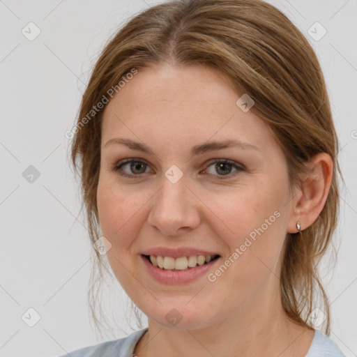 Joyful white young-adult female with medium  brown hair and grey eyes