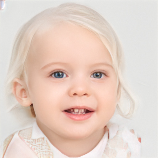 Joyful white child female with medium  blond hair and blue eyes