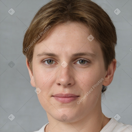 Joyful white young-adult female with short  brown hair and grey eyes