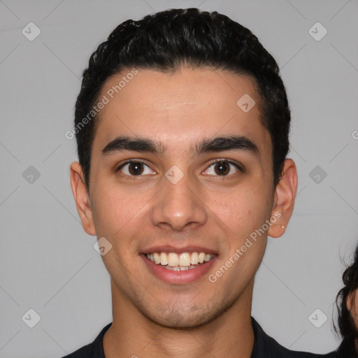 Joyful white young-adult male with short  black hair and brown eyes