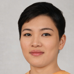 Joyful asian young-adult female with short  black hair and brown eyes