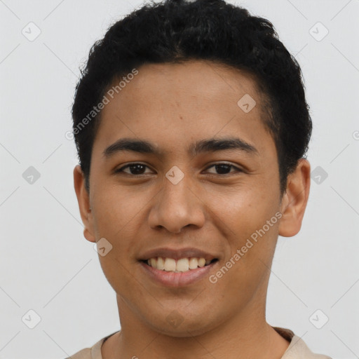 Joyful latino young-adult male with short  black hair and brown eyes