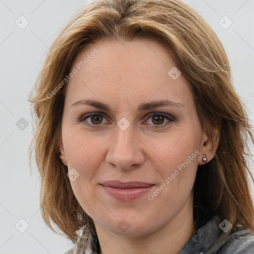 Joyful white adult female with medium  brown hair and brown eyes