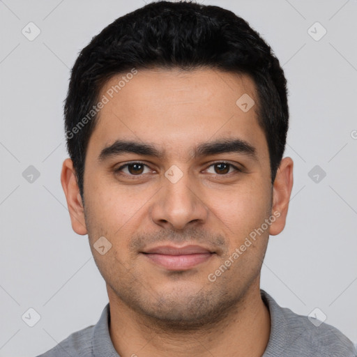 Joyful latino young-adult male with short  black hair and brown eyes