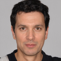 Neutral white adult male with short  black hair and brown eyes