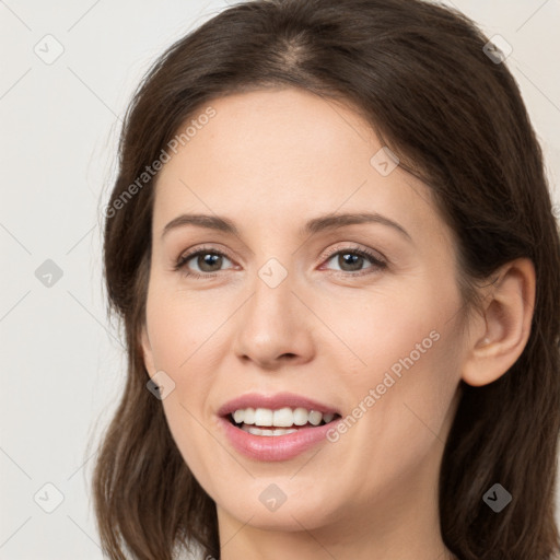 Joyful white young-adult female with long  brown hair and grey eyes