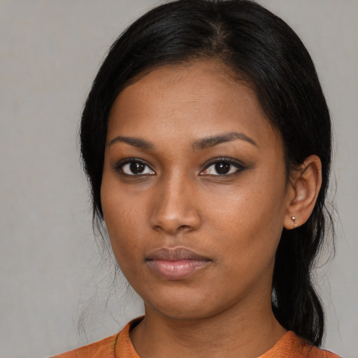 Neutral black young-adult female with medium  black hair and brown eyes