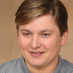 Joyful white adult male with medium  brown hair and brown eyes