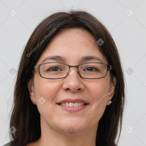 Joyful white adult female with medium  brown hair and brown eyes