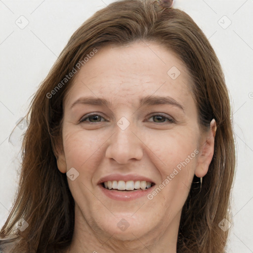 Joyful white adult female with long  brown hair and grey eyes