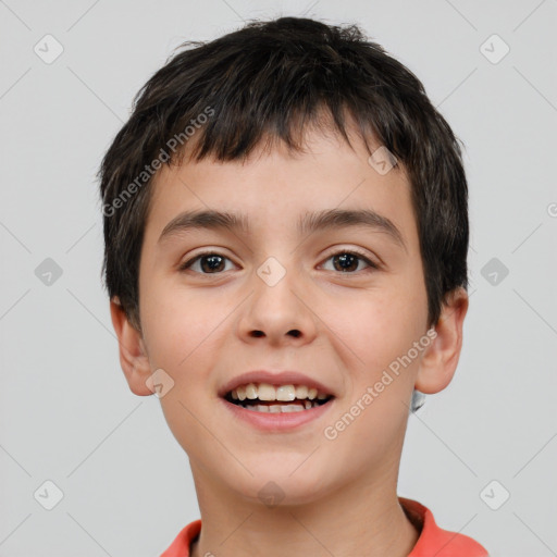 Joyful white child male with short  brown hair and brown eyes