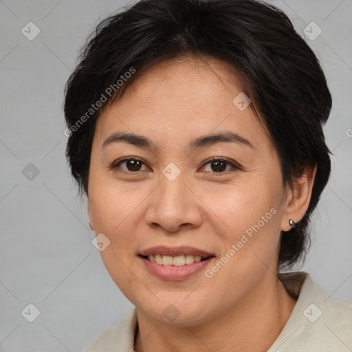 Joyful asian adult female with medium  brown hair and brown eyes