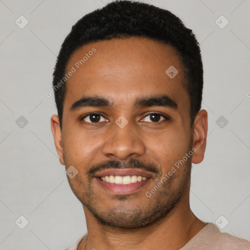 Joyful black young-adult male with short  black hair and brown eyes