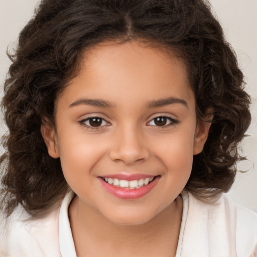 Joyful white child female with medium  brown hair and brown eyes